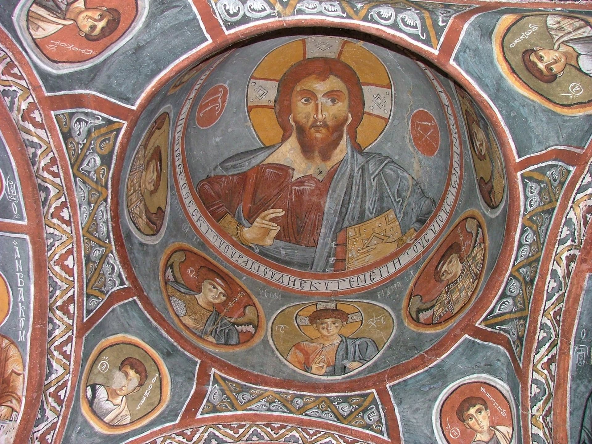 Byzantine fresco of Christ Pantocrator painted on a domed cave church ceiling