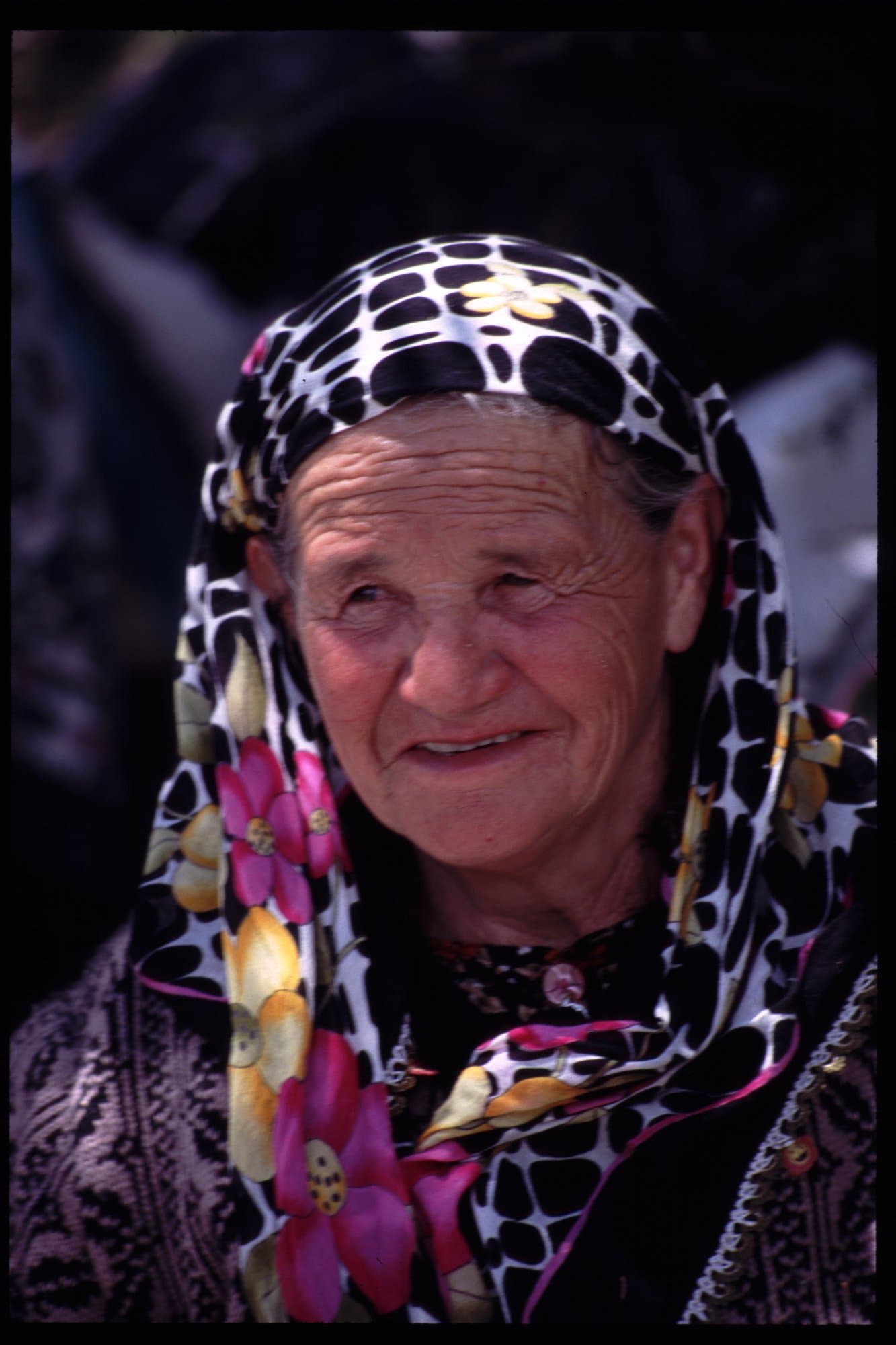 Portrait of an elderly woman in a floral headscarf in the Taurus Mountains