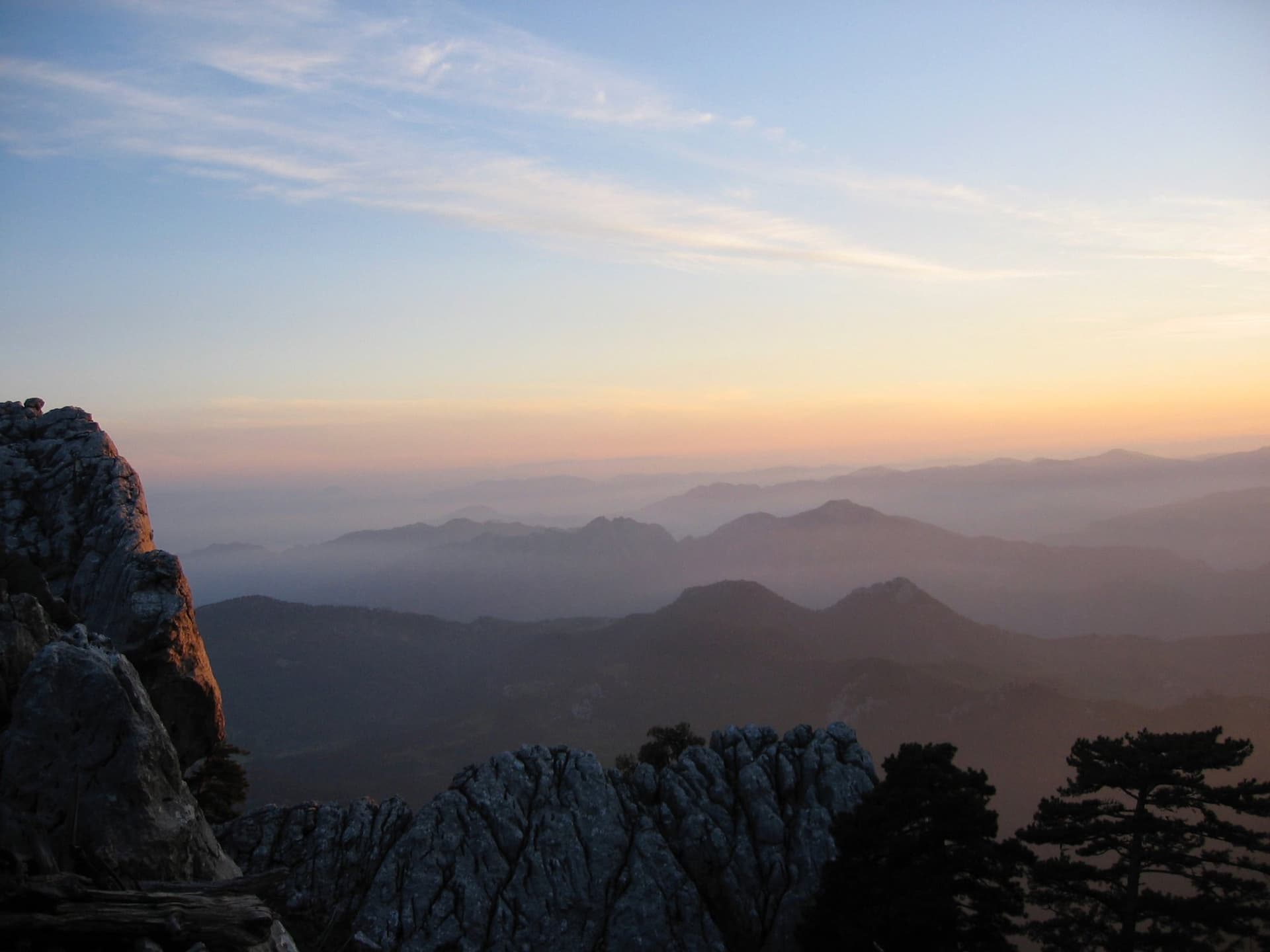 Sunrise light over jagged rocky peaks and layered ridges in the Taurus Mountains